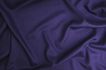 Texture of cotton fabric in oriental blue-purple color, top view. Background, texture of draped...