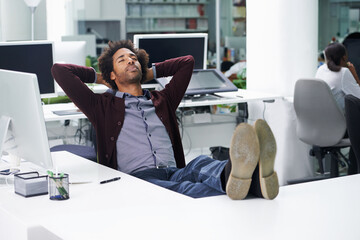 Break, relax or sleep with business man at desk in office, feet up for finished project and task. Computer, eyes closed and rest with confident young employee in workplace for complete or done work