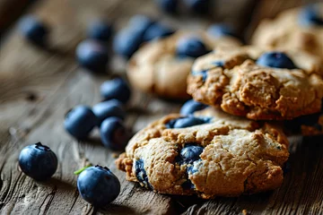  cookies with blueberries on a wooden background © Olga