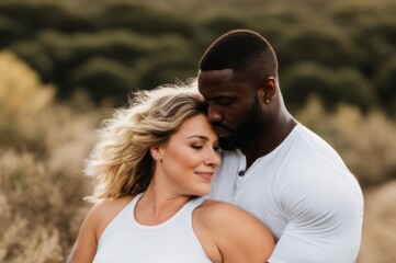 muscular african man hugging beautiful white woman, romance of sexy lovers, interracial couple