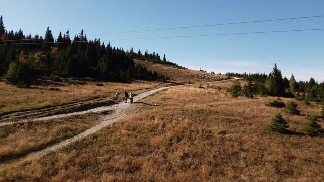 Drone ascending along a serpentine foot path on the top of Rax mountain