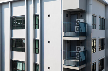 Exterior of building with air conditioning on balconies