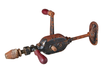 Old and rusty vintage drill hand operated isolated on white