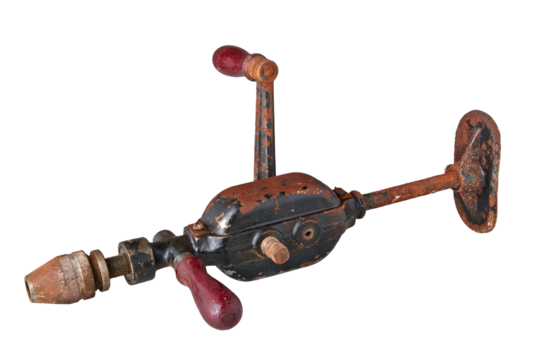 Old and rusty vintage drill hand operated isolated on white