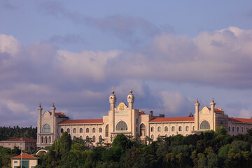 View from the water of the Bosphorus Strait to ancient palaces and buildings. Public place on the street of Istanbul, Türkiye.