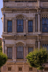 View from the water of the Bosphorus Strait to ancient palaces and buildings. Public place on the street of Istanbul, Türkiye.