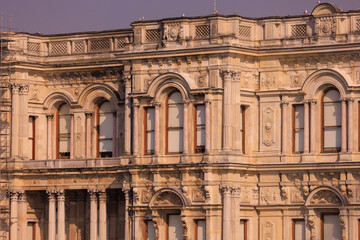View from the water of the Bosphorus Strait to ancient palaces and buildings. Public place on the street of Istanbul, Türkiye.