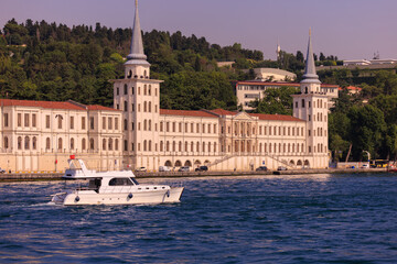 Fototapeta na wymiar View from the water of the Bosphorus Strait to ancient palaces and buildings. Public place on the street of Istanbul, Türkiye.