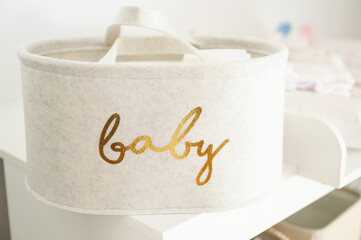 A textile basket for a newborn baby
