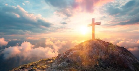 Silhouettes of crucifix symbol on top mountain with bright sunlight on the colorful sky background. - obrazy, fototapety, plakaty