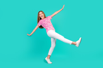 Full size photo of pretty teenager girl falling down fly walk dressed stylish pink print outfit isolated on aquamarine color background - obrazy, fototapety, plakaty