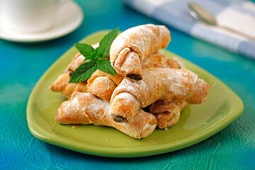 Puff pastry rolls with chocolate and walnuts.