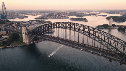 Aerial drone view of Sydney Harbour Bridge, NSW Australia showing two trains crossing the bridge...