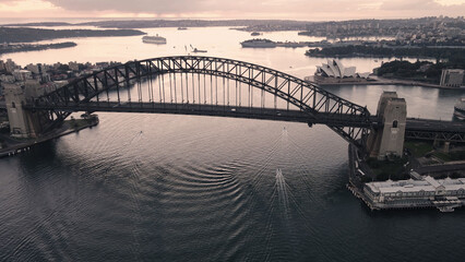Aerial drone view of Sydney Harbour Bridge, NSW Australia during an early morning sunrise in March...