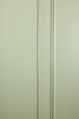 A wall covered with light green paint and molding - 758809272