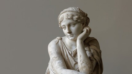 Antique sculpture of a pensive young woman. Statue of a seated Greek woman with her hand at her forehead