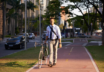 Fototapeta premium Bicycle, city and portrait of happy businessman for travel, morning commute and walking to work. Professional, urban town and person with bike for cycling, sustainable and eco friendly transport