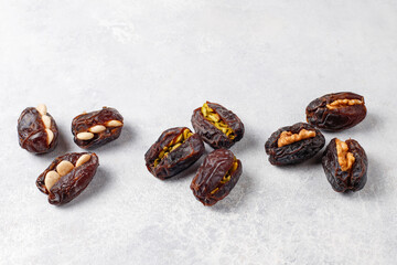 Fresh organic and various sweet dried date fruits.