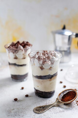 Traditional italian desert tiramisu in a jar.