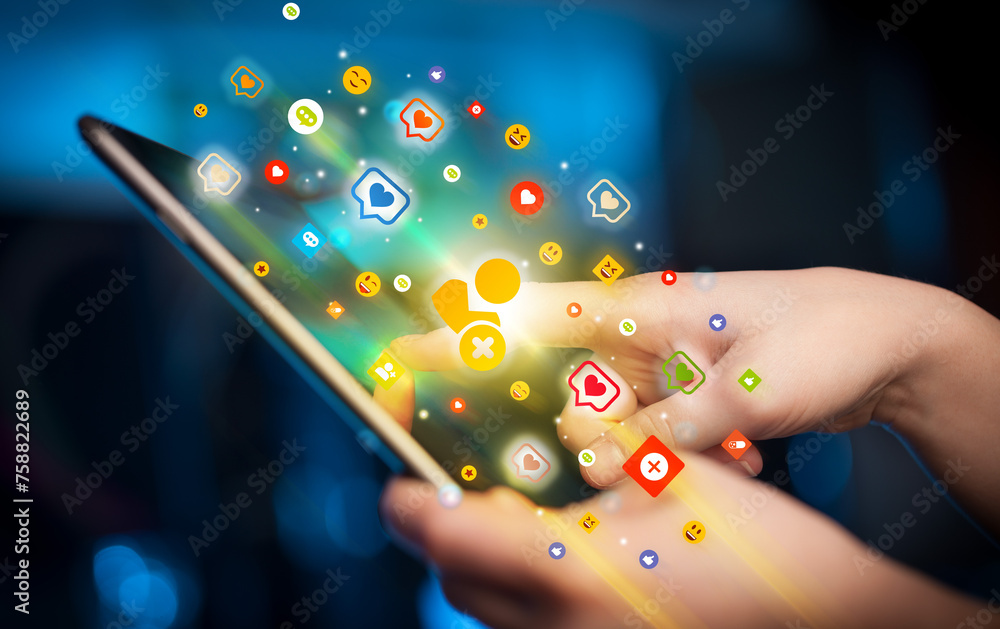Aufkleber close-up of a hand using tablet with social media icons