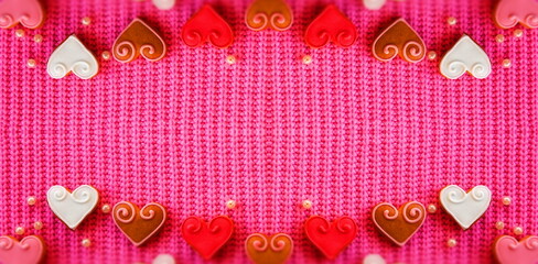 Abstract Creative background for Valentine's day. Red Hearts on a Pink Background. Symmetrical...