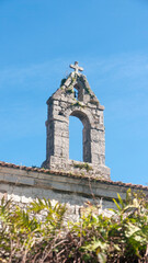 Fototapeta na wymiar Campanario vacío en iglesia de piedra