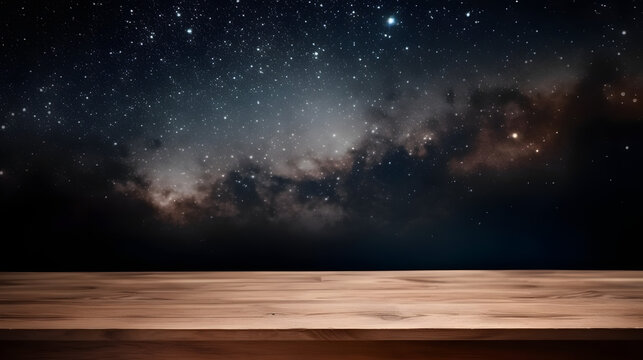 Empty wooden table in front of space background