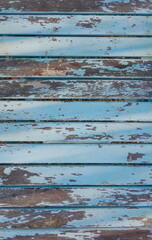 Aged Patina on Weathered Blue Wooden Boards. The Rustic Charm of Faded Paint and Time-Worn Wood