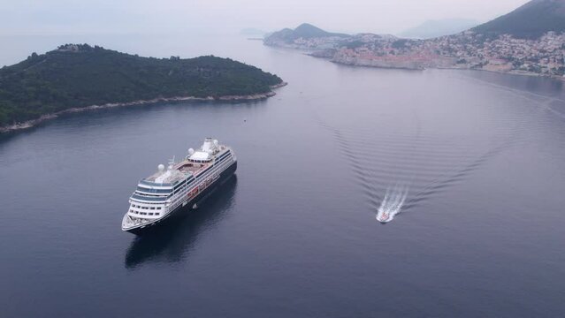 Dubrovnik, Croatia - 11 may 2023: Aerial view of Luxury Azamara onward cruise ship anchored at Adriatic sea, Dubrovnik, Croatia