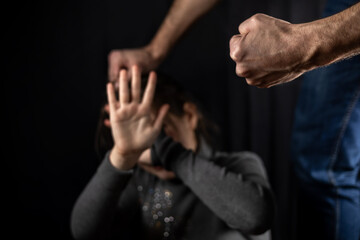 Domestic violence man against child clenched fist - obrazy, fototapety, plakaty