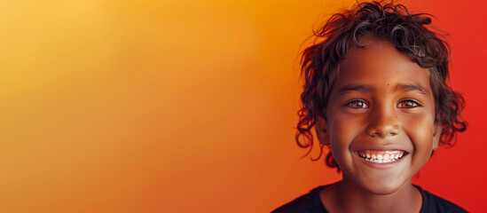 One happy 10 yr old boy student Indigenous Aboriginal Australian kid curls hair black skin diverse positive  portrait isolated first nation dreamtime child education reconciliation equality copy space