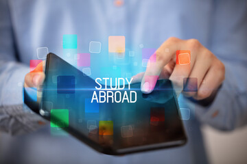 Young man holding a foldable smartphone