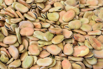 Image of broad beans stocked in market for consumption.