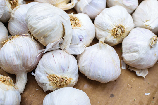 Image of garlic stocked in market for consumption.