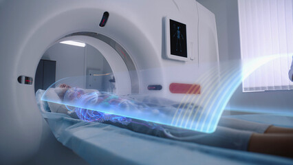 Woman undergoes MRI or CT scan diagnostic, lies on bed moving inside the machine. VFX animation of...