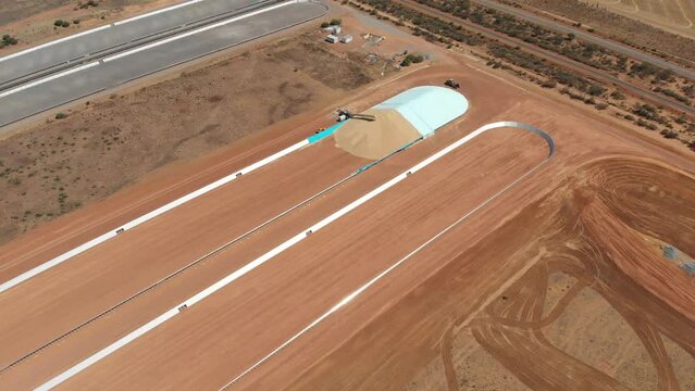 Aerial view of construction of open bulkhead grain storage, Western, Australia