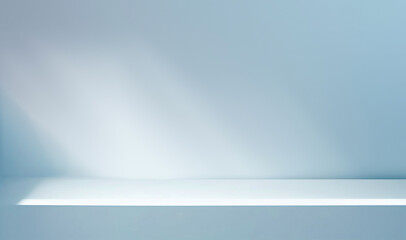 Minimalistic simple background for product presentation. Shadow and light from windows on a light blue wall.
