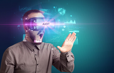 Businessman looking through Virtual Reality glasses