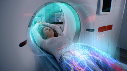 Woman undergoes MRI or CT scan procedure, lies on bed inside the machine. VFX animation of scanning...