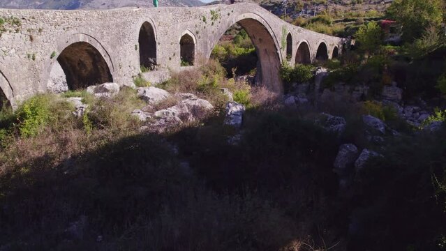 Aerial view of old ottoman mesi bridge over the Kir river, Shkoder, Albania