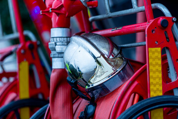 French firefighter helmet placed on the back of a fire vehicle