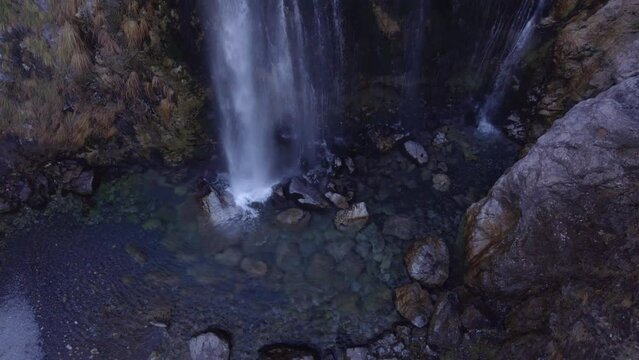 Aerial view of Grunas waterfall in the Albanian Alps during autumn season, Theth, Albania