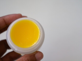 natural lip balms from beeswax in tin circle jar.