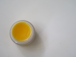 natural lip balms from beeswax in tin circle jar.