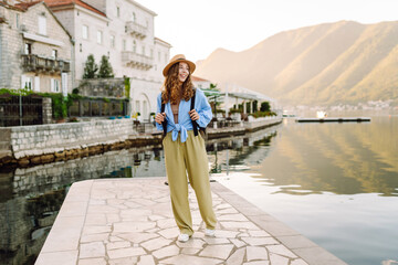 Happy tourist walks the streets and enjoying architecture of the city. Lifestyle, travel, tourism,...