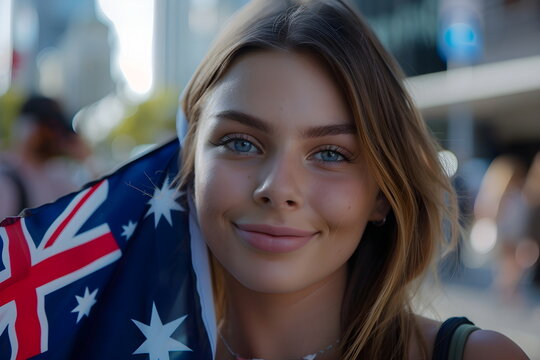 young woman holding national flag of Austraia on street
