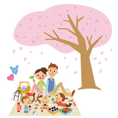 Obraz premium 桜の木の下でピクニックを楽しんでいる家族