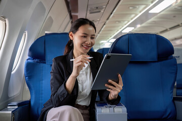 Young Asian executives are first class. Multitask with digital tablets, laptops and smartphones....
