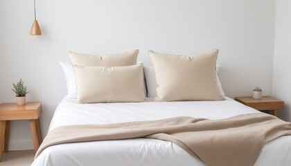 Fototapeta na wymiar Beige cushion on white bed