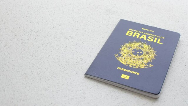 Close-up of the Brazilian passport against a white background, symbolizing travel and citizenship. Clear image of a Brazilian passport on a white background, emphasizing authenticity and simplicity.